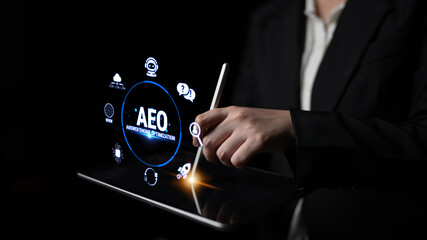 Obraz premium Business professional using digital tablet for data visualization and application development with modern user interface elements and icons in dark setting Fluxor.