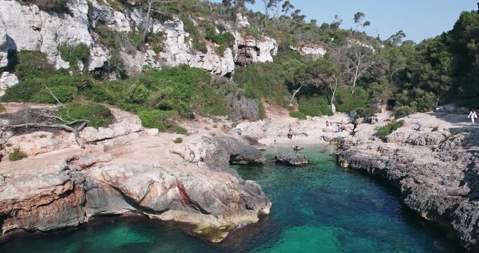 People Enjoying Scenic Cala S Almunia Beach Mallorca Spain