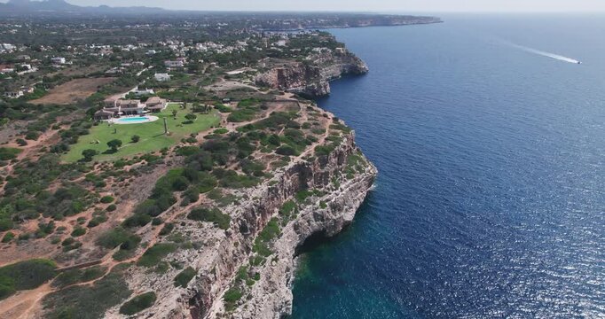 Aerial View of Luxury Houses on Cliff overlooking Cala Llombards Mallorca