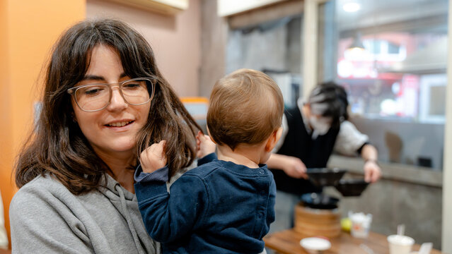 Family enjoying dumplings in a cozy taiwanese restaurant