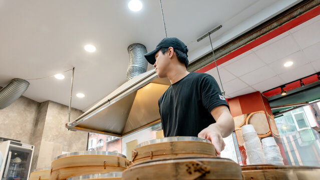 Chef preparing xiaolongbao in Taiwanese restaurant