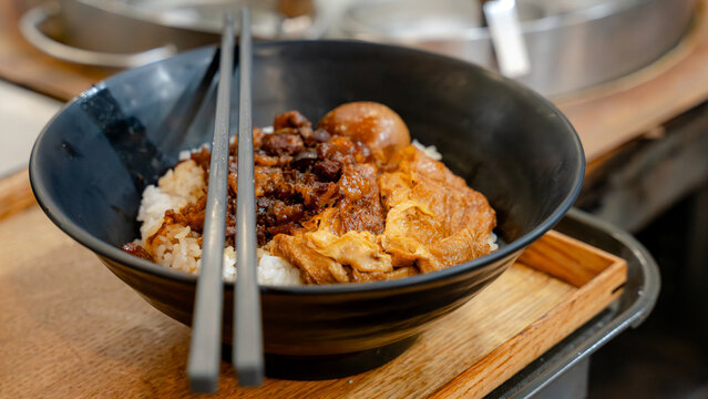 Taiwanese braised pork rice with egg and chopsticks