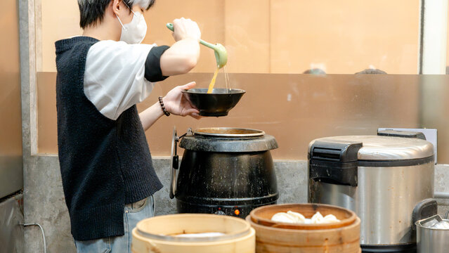Taiwanese chef prepares meal in traditional restaurant