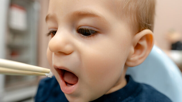 Child enjoying food in a Taiwanese restaurant