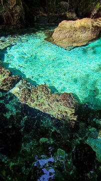 Hidden lake with crystal water. Remote destination in Sulawesi, Indonesia