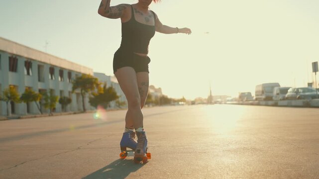 Tattooed woman roller skating during sunset