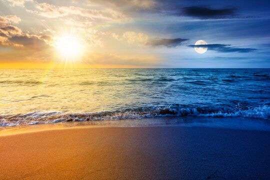 vacation at the sea on autumn equinox. day meet night. sun and moon over beautiful seascape. waves wash the sandy beach. image with epic sky above horizon. background for relaxation or ads placement