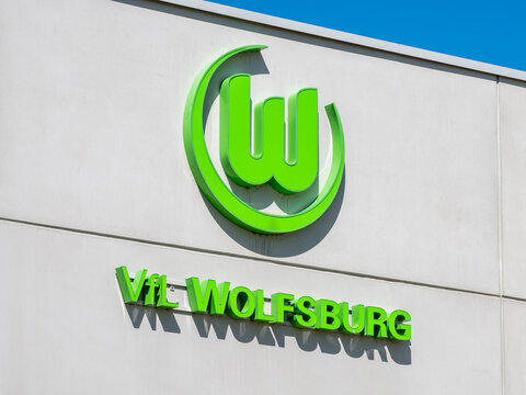 WOLFSBURG, GERMANY, 28 April 2026: VfL Wolfsburg football club logo on stadium Wolfsburg Arena building against blue sky