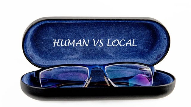 A pair of blue framed eyeglasses lies open in a blue velvet case with Human vs Local text. It is set on a clean white background