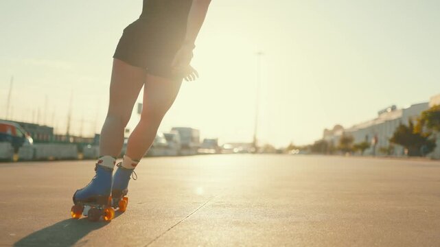 Woman with tattoos roller skating during sunset