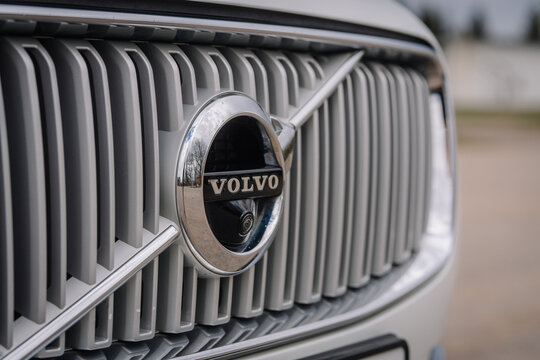 Close-up of a Volvo car grille featuring the iconic logo and distinctive design elements, showcasing modern automotive craftsmanship