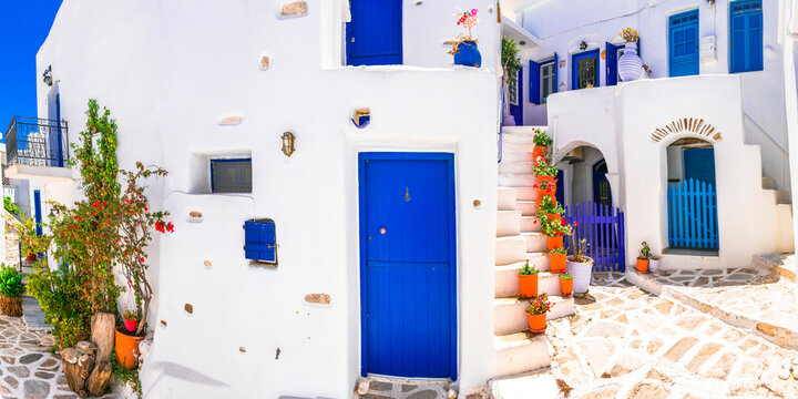 Lefkes Paros Greece Traditional Street, White Houses with Blue Doors and Stone Stairs, greek Rustic Charm Aesthetics with Floral Decor, Typical Cycladic Architecture and Pavement Summer Travel