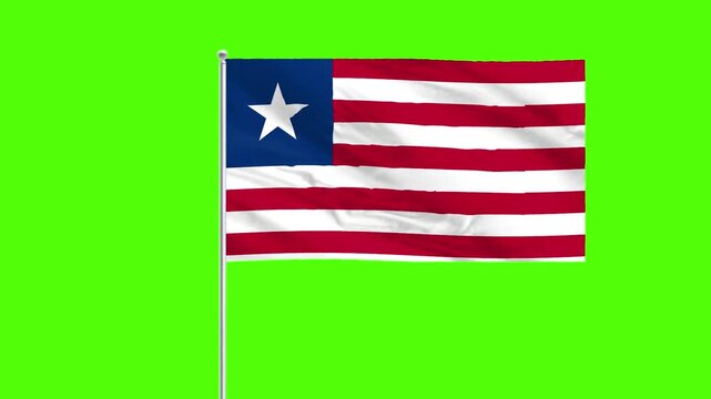 Liberian Flag Waving: A vibrant Liberian flag gracefully waves in the wind, a powerful symbol of nationhood, liberty, and the rich history of Liberia. The flag is set against a solid green background.