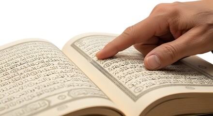 Naklejka premium Finger pointing at sacred text in open book during study in studio lighting