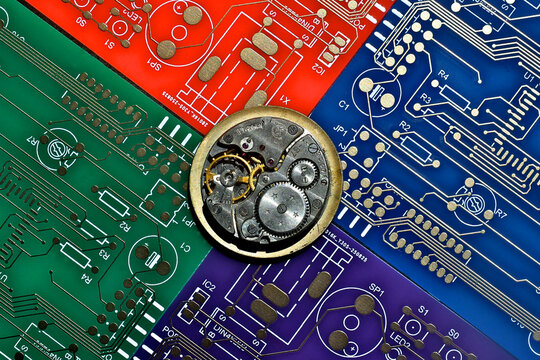 A metaphor for mechanical vs electronic. Inner workings of windup watch and circuit boards 