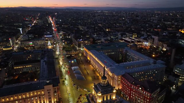 Night aerial view of the capital of Bulgaria, Sofia. Architectural and emblematic buildings from the communist era in the city center. Council of Ministers, Presidency and Party House. Sunset, sunrise
