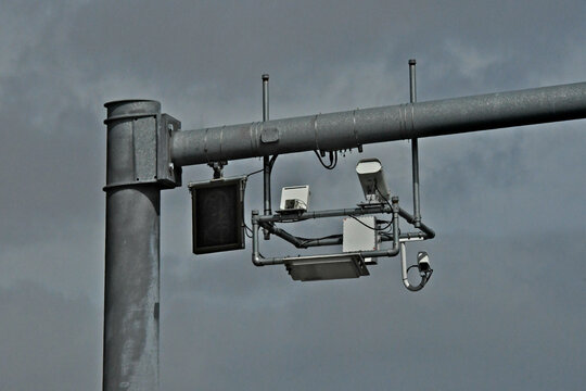 Closeup of FasTrack electronics over interstate freeway 