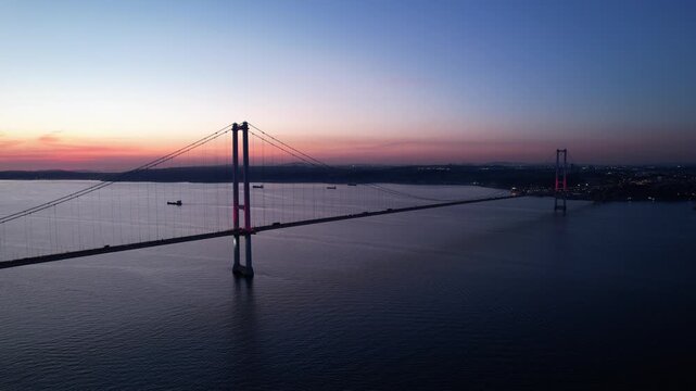 Osmangazi Bridge in Kocaeli, Turkey. Aerial shot with drone. Beautiful sunset landscape. 