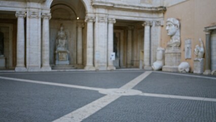 Classical museum courtyard with carved statues and colonnade, softly defocused  background backdrop copyspace calm. © Krakenimages.com