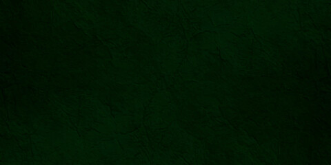 Deep forest green textured paper background with subtle grain and organic fiber details for elegant luxury backdrop. © Jharna Akter