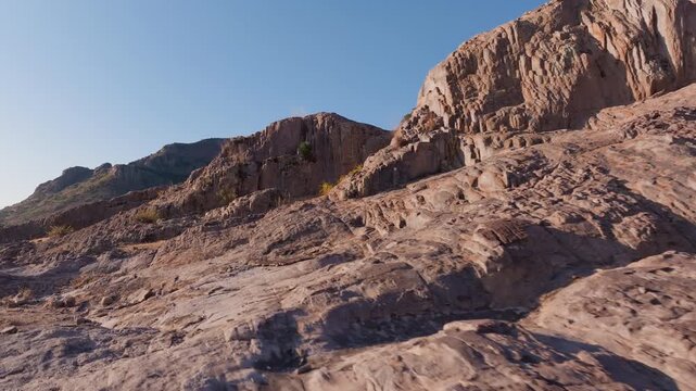 Aerial drone footage sweeps across rugged rocky terrain in Sierra Madre Occidental mountains near Durango, Mexico.
