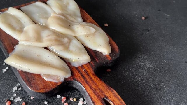 Raw squid fresh seafood marinated tasty snack fresh gourmet food background on the table  rustic food top view copy space pescetarian diet