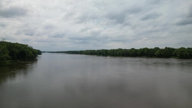 In the middle of the Mississippi River between Southern Illinois and Iowa flying up shows the length and width of this important river for transportation.  4k, drone, flying
