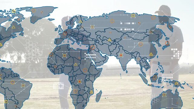 Two men walking in sunny field, map fading in over shadows, filling icons, showing business reach
