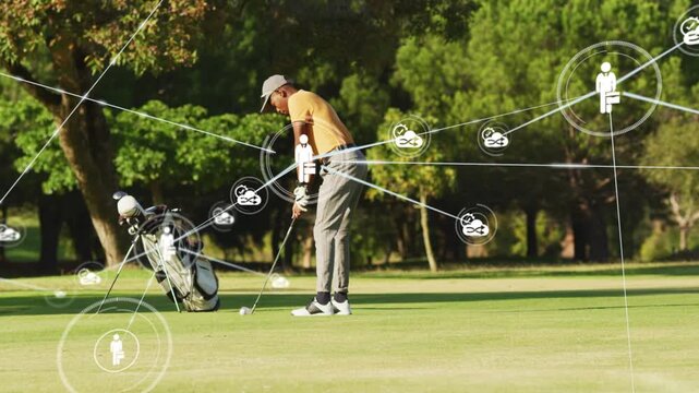 Male golfer addressing ball, starting swing for shot while tech network icons linking, intensifying