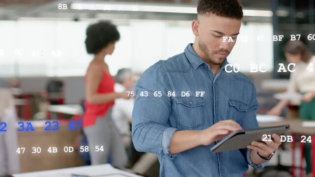 Man tapping tablet in design office and starting floating data overlay over team as checking plans