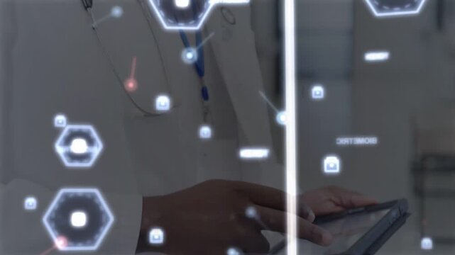 Male clinician tapping and swiping tablet, hex HUD showing health data, camera pulling back