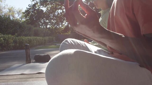 Couple meditating on yoga mat, overlay appearing over laps, animating subscribe bar, boosting subs