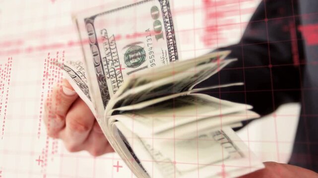 Thumb starting riffle, hands fanning 100-dollar bills while red grid shifting, showing stack depth