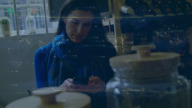 Woman picking up phone tapping while checking product info at shop counter light streaks over jars