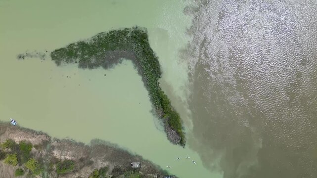 Close aerial view of the confluence of the Aragvi River and Mtkvari River near Mtskheta, showing distinct water colors.
