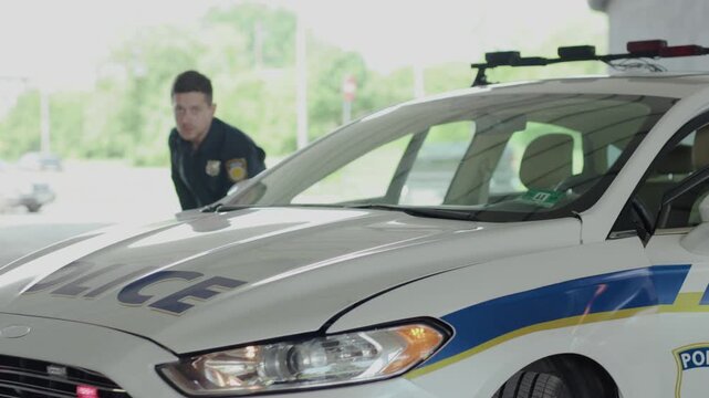 Dangerous situation two policemen leave the patrol car pulling pistols danger delinquent gangster gun gunpoint handgun hold illegal intruder law offender burglar teamwork close up