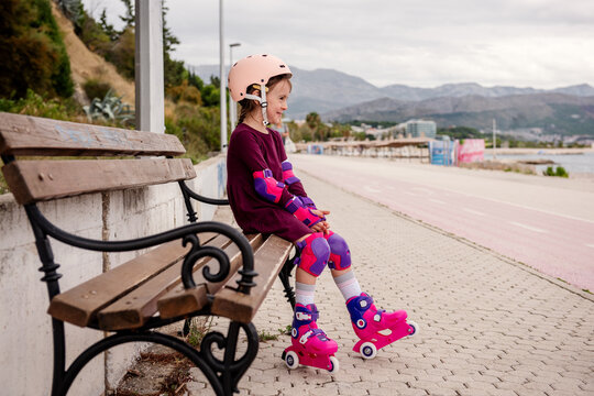 Young girl learning to roller skate outdoor