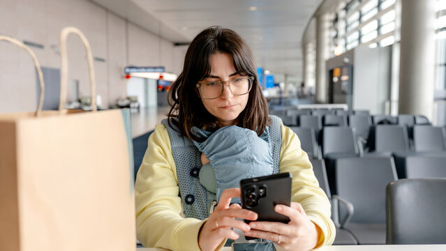 Mother and baby waiting at the airport terminal