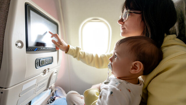 Family journey with baby on airplane flight
