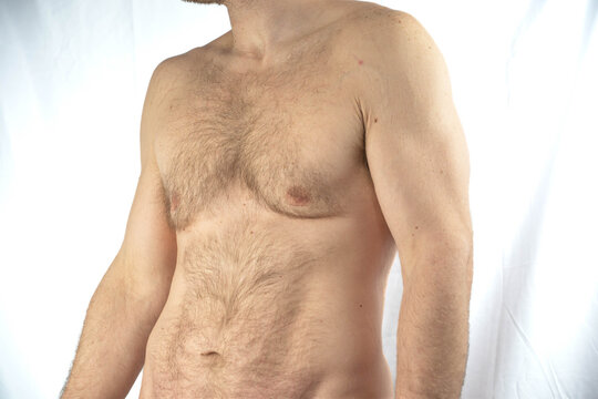 Copy space selective focus upper body no shirt man isolated on white background, muscular hairy guy with body fat on him, Wellnes weight lose, macho