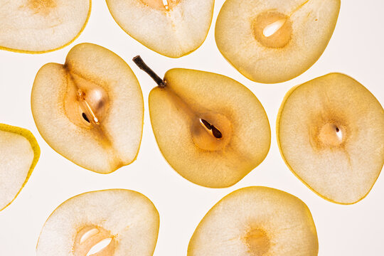 Pattern of pear slices on a clean white background