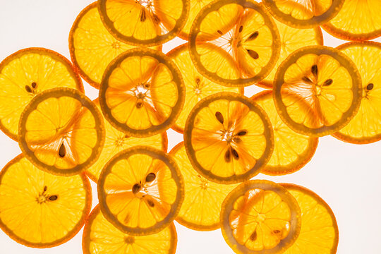 Bright orange citrus slices background with fresh texture