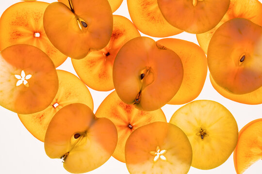 Apple slice background in warm orange tones, flat lay
