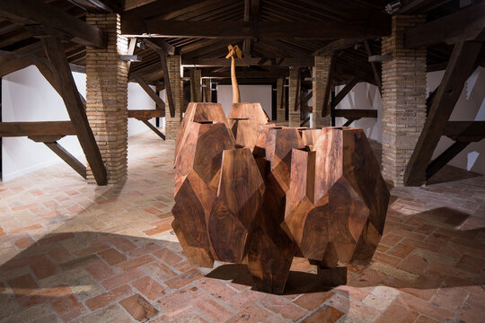 Contemporary abstract wooden sculpture in rustic space