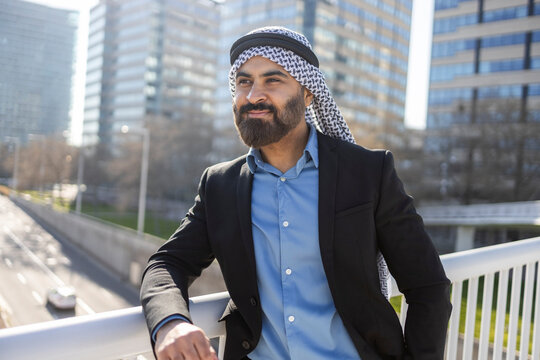 Arab businessman sheikh in modern city posing outdoors