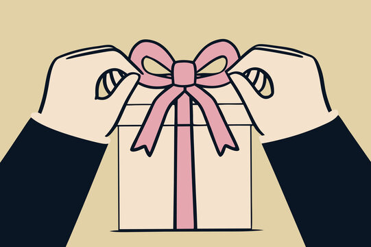 Hands wrapping gift box with pink ribbon on light background