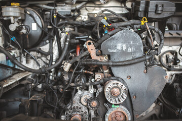 Fototapeta premium Detailed view of a complex automotive engine with intricate wiring and mechanical components