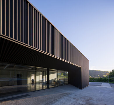 Modern candy factory exterior with steel facade and glass