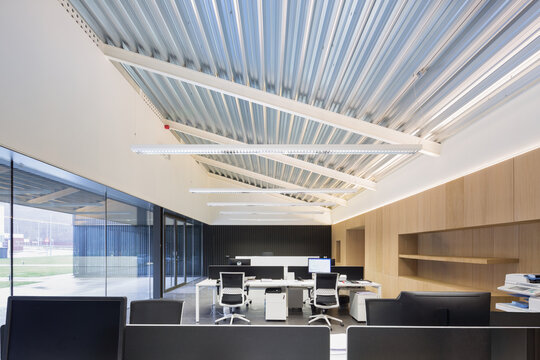 Modern candy factory office interior with workstations