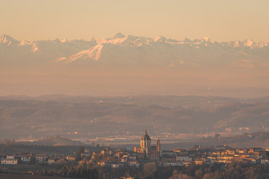 Sunset panorama of Piemonte town with alpine backdrop
